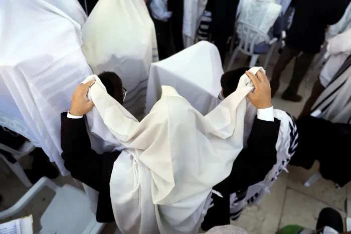 Framed Print : Jewish worshippers wrapped in prayer shawls participate in the priestly blessing prayer