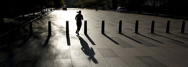 Jogger casts a shadow in Washington