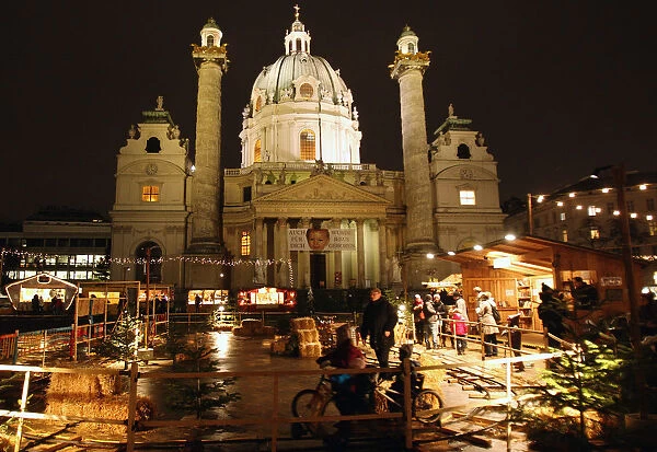 Karlskirche church is pictured behind an advent market in Vienna