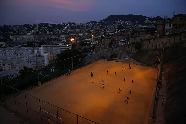 Kids play soccer during a training session at Sao Carlos slum in Rio de Janeiro