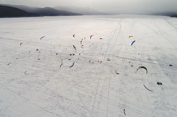 Kite boarders and kite skiers compete on the ice-covered Yenisei River outside Krasnoyarsk