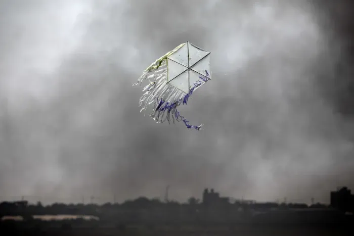 Framed Print : A kite flies over the border in an area where kites and balloons have caused blazes Framed Print : A kite flies over the border in an area where kites and balloons have caused blazes