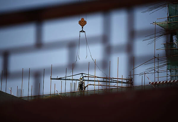 A labourer works at a construction site in Beijing