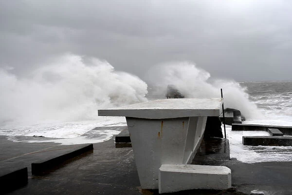 Large waves break over the Forty Foot diving area as Storm Emma makes landfall in Dublin