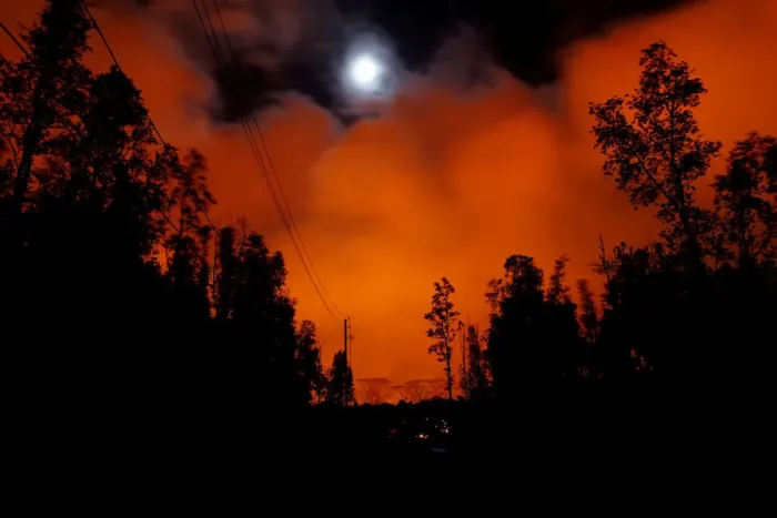 Framed Print : A lava flow from the Kilauea volcano illuminated the night sky