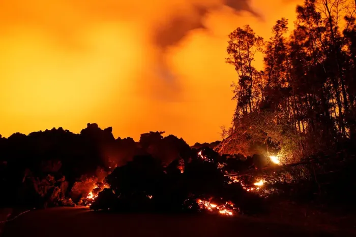 Framed Print : A lava flow from the Kilauea volcano illuminates the night sky Framed Print : A lava flow from the Kilauea volcano illuminates the night sky