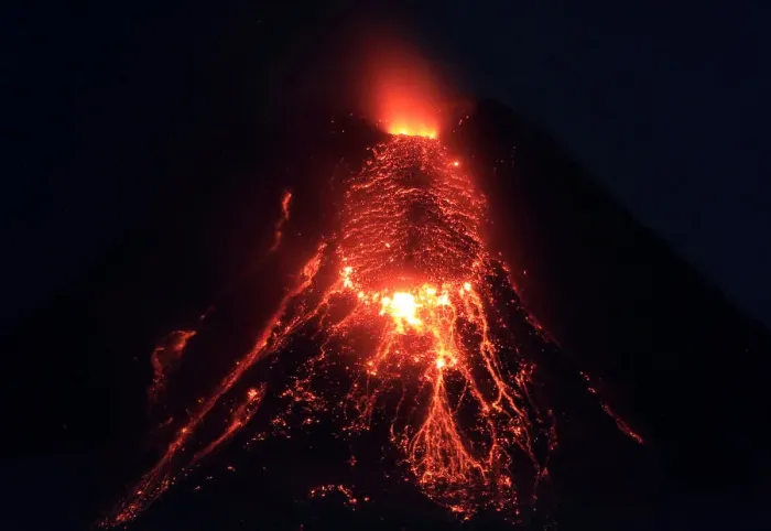 Framed Print : Lava flows from the crater of Mount Mayon Volcano during an eruption in Legazpi city