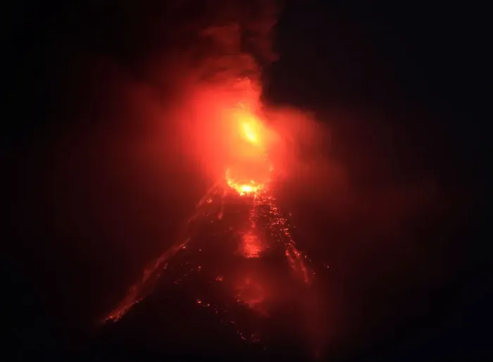 Framed Print : Lava flows from the crater of Mount Mayon Volcano during an eruption in Legazpi city