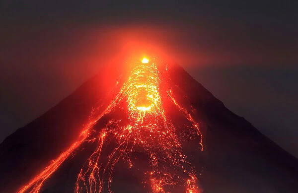 Lava flows from the crater of Mount Mayon volcano during a new eruption in Legazpi city