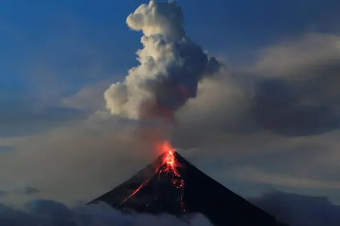 Framed Print : Lava flows from the crater of Mount Mayon volcano during a new eruption in Legazpi city Framed Print : Lava flows from the crater of Mount Mayon volcano during a new eruption in Legazpi city