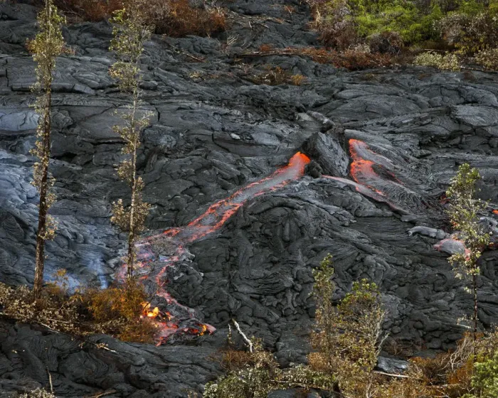 Framed Print : Lava spouts from a hot spot as the lava flow from Mt. Kilauea inches closer to Framed Print : Lava spouts from a hot spot as the lava flow from Mt. Kilauea inches closer to