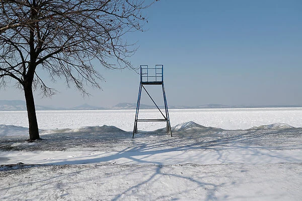 A lifeguard tower is seen during a winter day on the shore of Lake Balaton in Fonyod