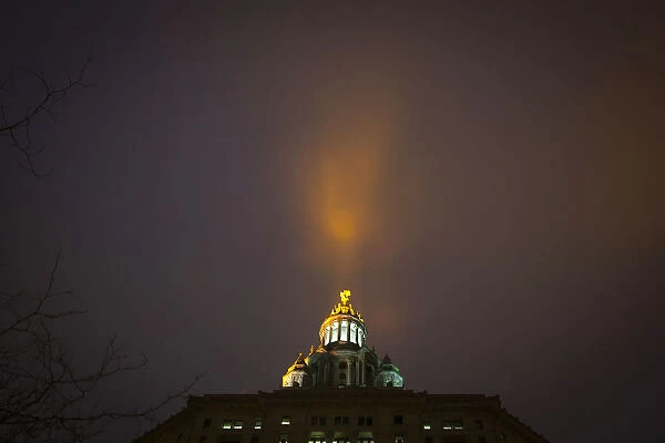 Light pours into fog bank from Manhattan Municipal building in Manhattan borough of