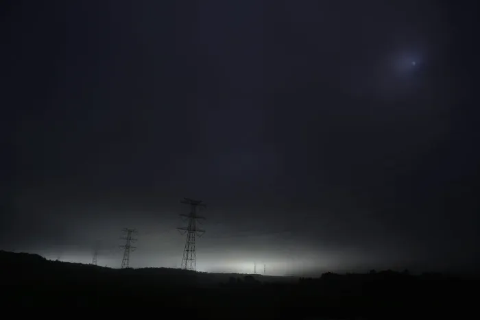 Framed Print : Light and power lines come from tsunami-crippled Daiichi nuclear power plant as seen Framed Print : Light and power lines come from tsunami-crippled Daiichi nuclear power plant as seen