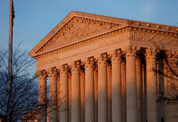 Light from the setting sun shines on the Supreme Court in Washington