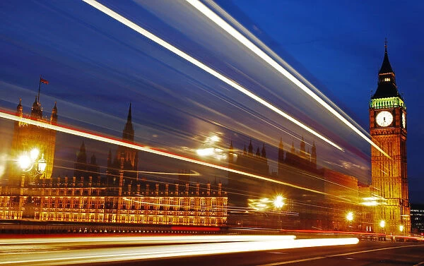 Light trails made by a passing bus illuminate the night sky in front of Britain s