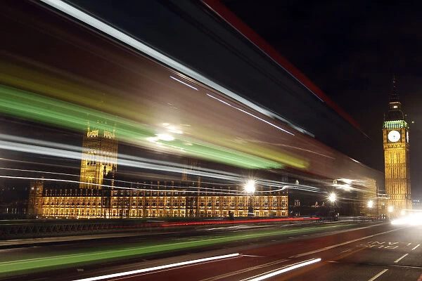 Light trails made by a passing bus illuminate the night sky in front of Britains Houses