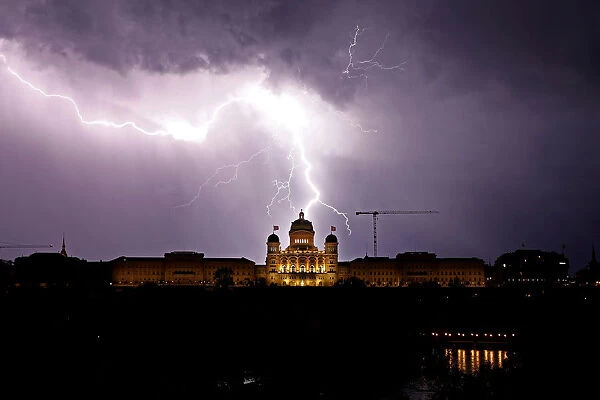 Lightning illuminates the sky above the Swiss Federal Palace in Bern
