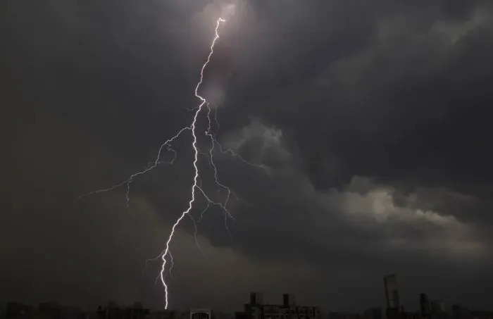 Framed Print : Lightning is seen above buildings during a storm in central Shanghai Framed Print : Lightning is seen above buildings during a storm in central Shanghai