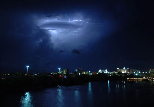 Lightning streaks across Cancuns night sky during a thunderstorm