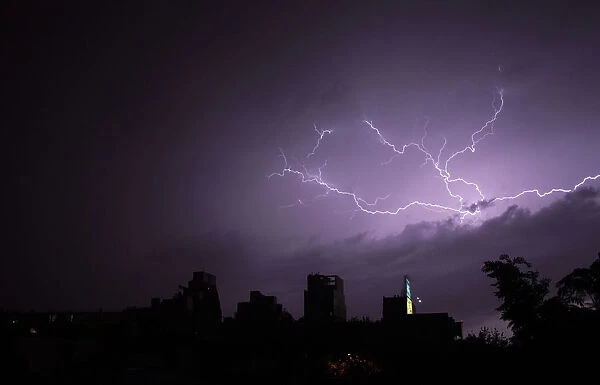 Lightning strikes over buildings during a thunderstorm in Buenos Aires