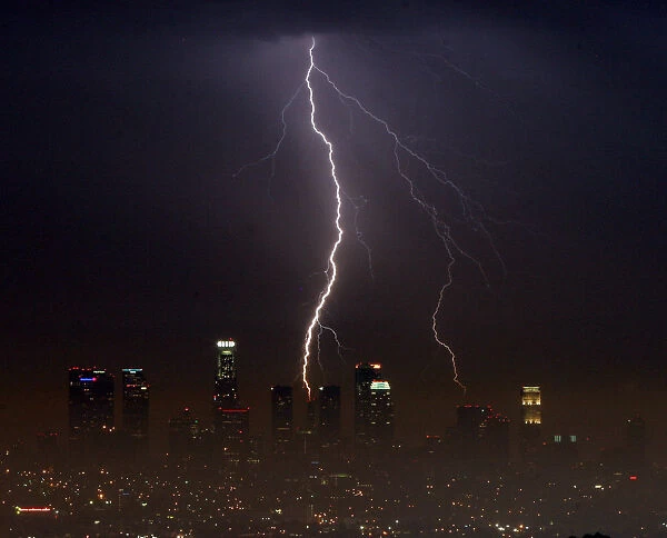 Lightning strikes over city of Los Angeles as tropical storm system makes it way through