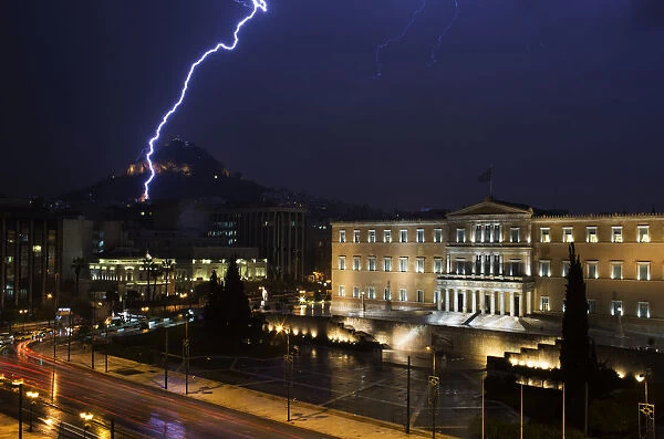 Lightning strikes near the Greek parliament building during heavy rainfall in Athens