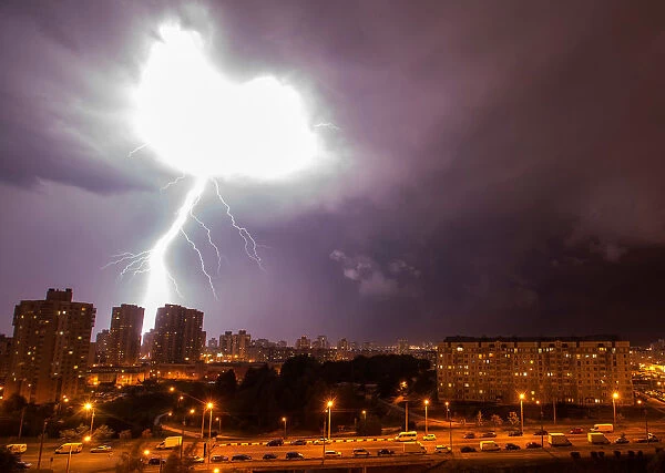 A lightning strikes are seen during a thunderstorm over the city of Minsk