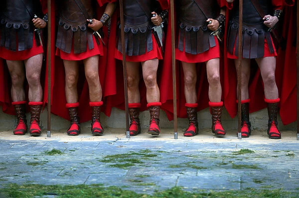 Locals dressed as Roman soldiers take part in a Via Crucis representation on Good Friday
