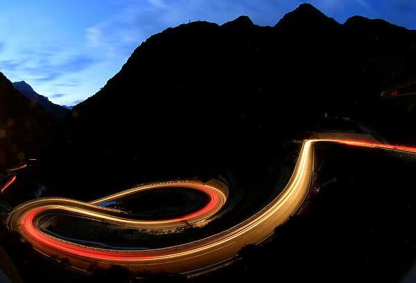Long exposure shows traffic flowing through the Schoellenenschlucht canyon near