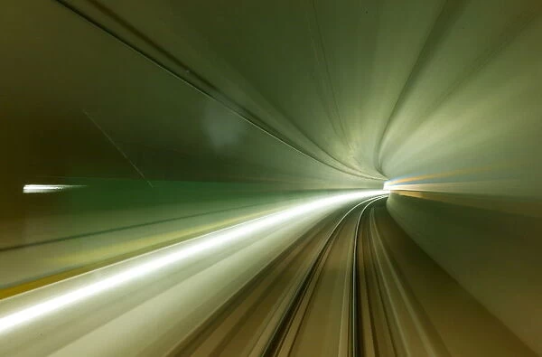 A long exposure is taken from a train driving through the NEAT Gotthard Base Tunnel