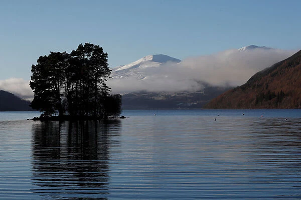 Low cloud drifts over Loch Tay in Perthshire