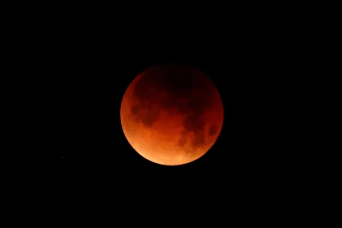 Framed Print : A lunar eclipse is shown over the ocean in Oceanside, California Framed Print : A lunar eclipse is shown over the ocean in Oceanside, California