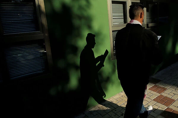 A man checks his documents after leaving a government-run job centre in Malaga