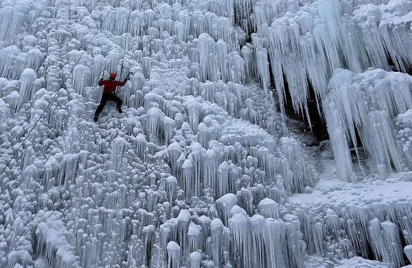A man climbs an artificial wall of ice in the city of Liberec