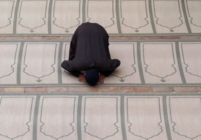 Framed Print : A man offers evening prayer at a mosque in Peshawar Framed Print : A man offers evening prayer at a mosque in Peshawar