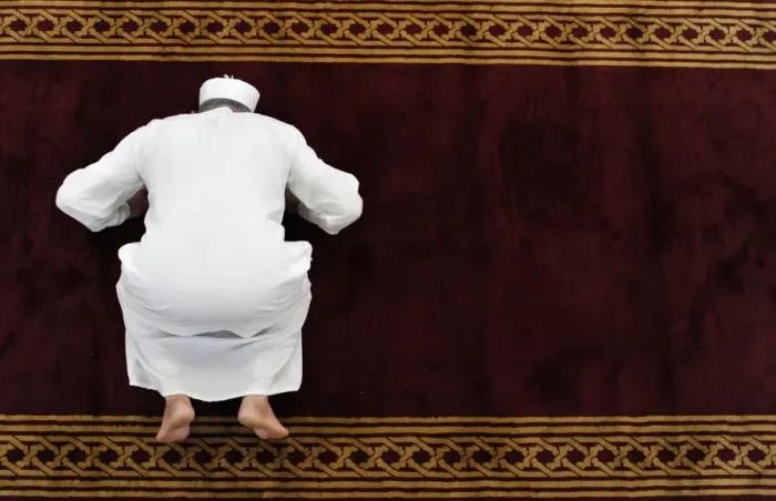Framed Print : A man prays in a mosque in the old city, in Tripoli