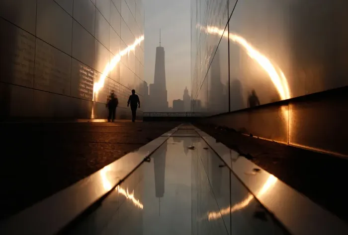 Framed Print : A man walks through the 9  /  11 Empty Sky memorial across from New Yorks Lower Manhattan