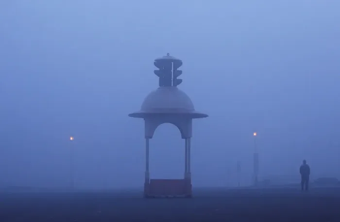 Framed Print : A man walks on a road amidst heavy fog on a winter morning in New Delhi
