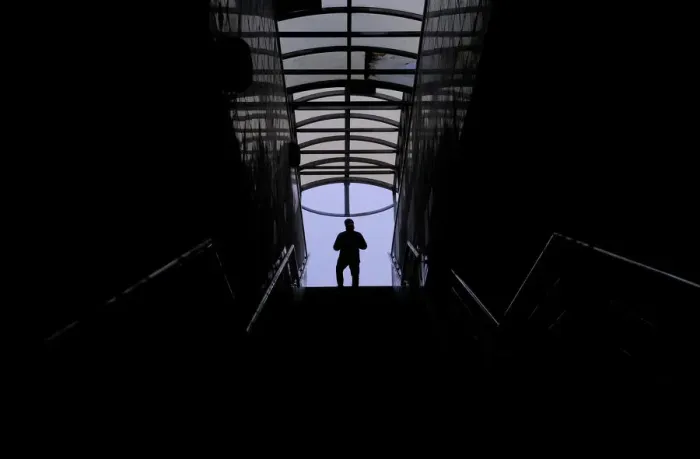 Framed Print : A man walks along a staircase in a pedestrian tunnel in Moscow