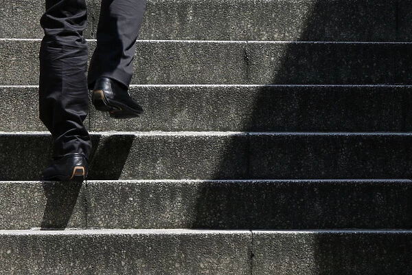 Man walks up stairs in Tokyo