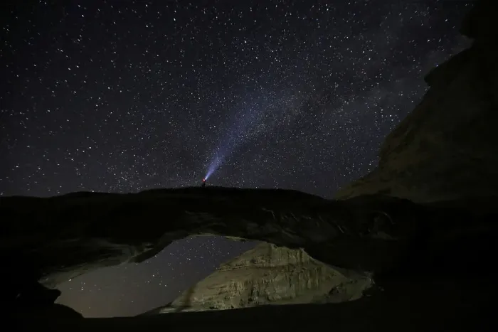 Framed Print : A man watches the stars seen on the sky of Al-Kharza area in Wadi Rum in the south of