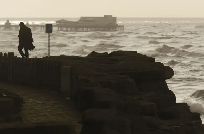 Framed Print : A man watches Storm Gertrude whips up the Irish sea off Blackpool as it crosses over Framed Print : A man watches Storm Gertrude whips up the Irish sea off Blackpool as it crosses over