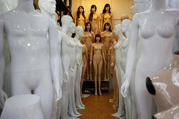 Mannequins are displayed for sale at a shop in Hanoi, Vietnam