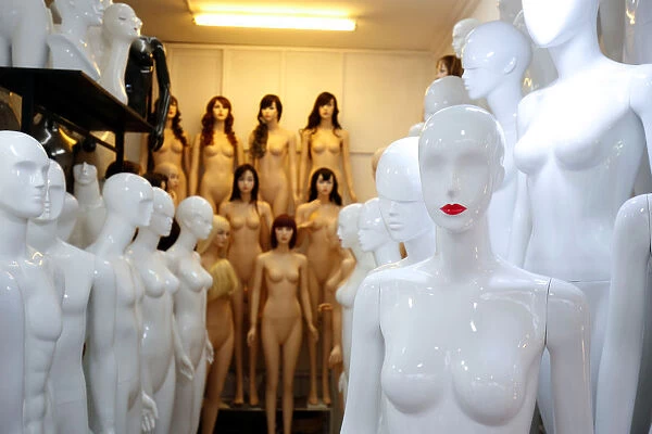 Mannequins are displayed for sale at a shop in Hanoi, Vietnam