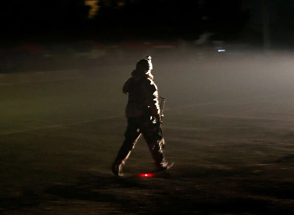 A member of the Afghan security forces arrives the site of an attack on the