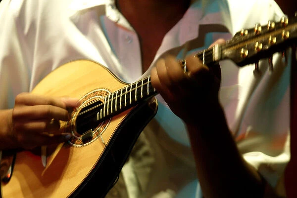 A member of Choros Scenarium group plays a Mamdolin guitar at Scenarium bar in Rio de Janeiro