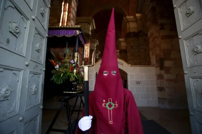 Framed Print : A member of the Nazarenos brotherhood takes part in a processsion on Good Friday in
