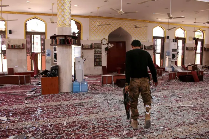 Framed Print : A member of security forces organized by the Saudi-led coalition inspects a mosque