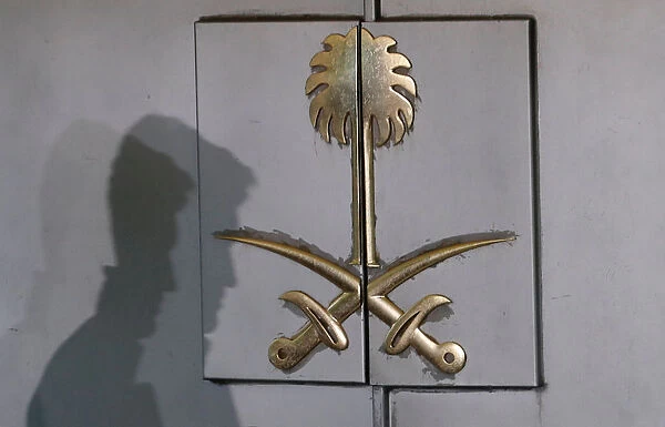 A member of security staff casts a shadow at the entrance of Saudi Arabias consulate
